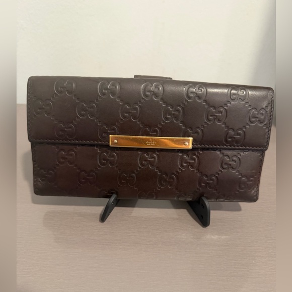 Gucci Handbags - Gucci Dark Brown Embossed Leather Wallet